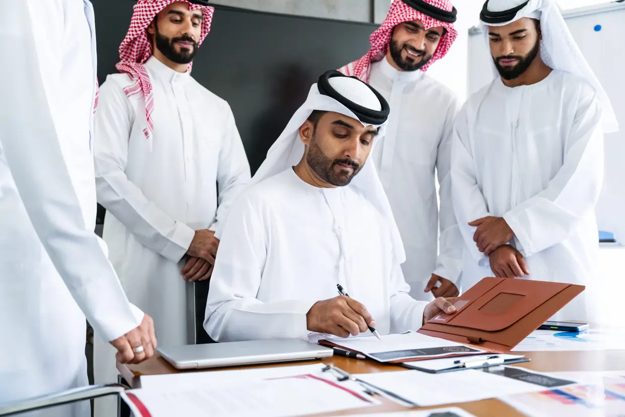 UAE administrative advisors reviewing official documents